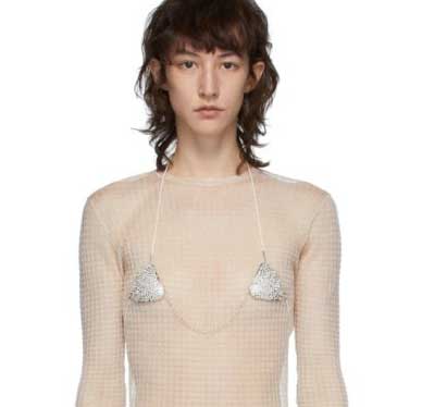Woman wearing intimate jewellery beneath a shirt