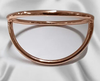 Rose gold Dome Splitter separating the penis and scrotum