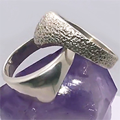 Solid silver glans bump cock ring.